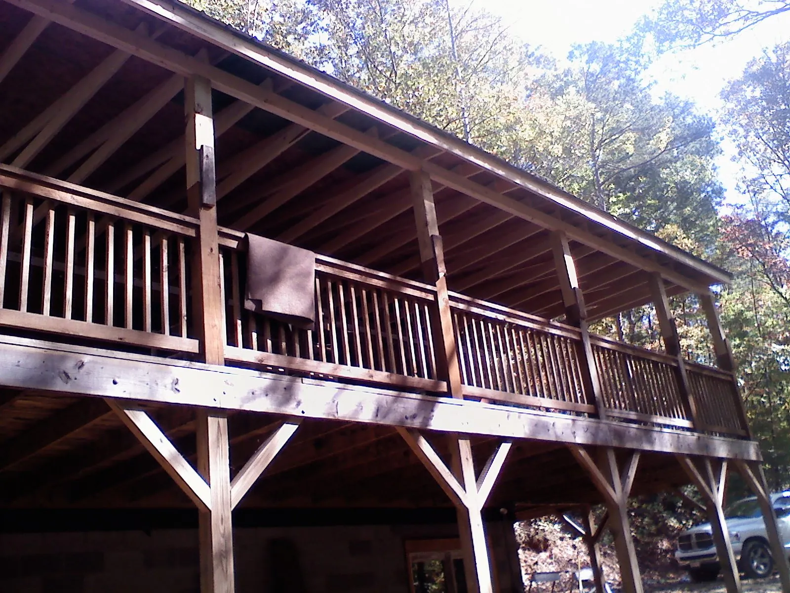 Timber framing under a new elevated porch and deck — Roof Leak Repair in Grimes by Roofing Brothers
